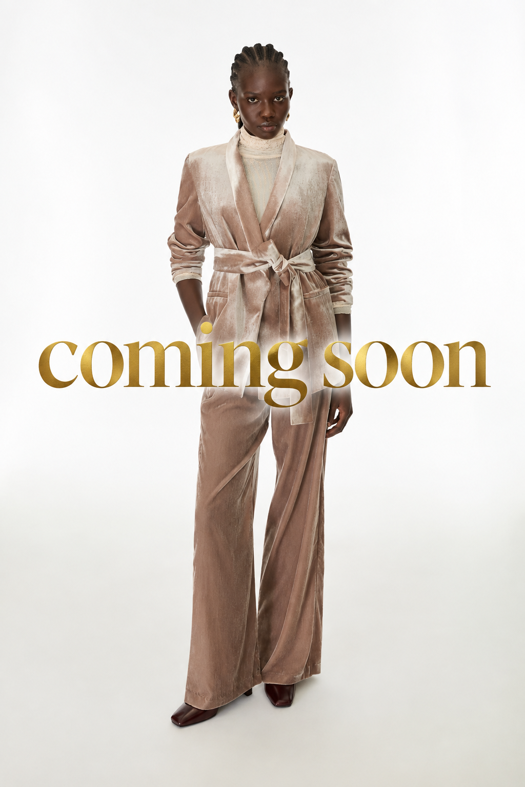 Image with large gold “coming soon” lettering across the centre