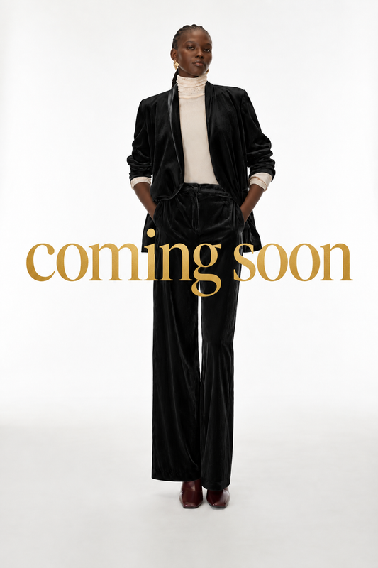 Image with large gold “coming soon” lettering across the centre