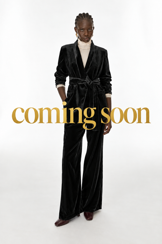 Image with large gold “coming soon” lettering centred across the middle
