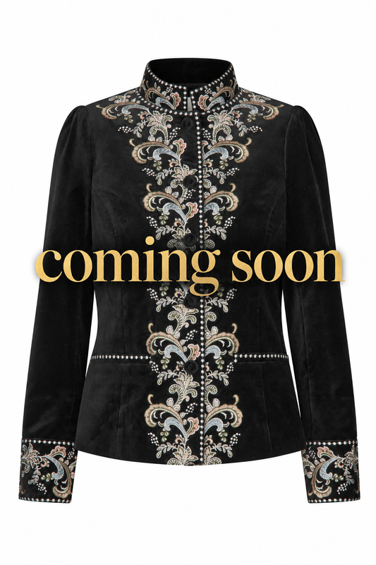 Jacket image with large gold “coming soon” lettering across the centre